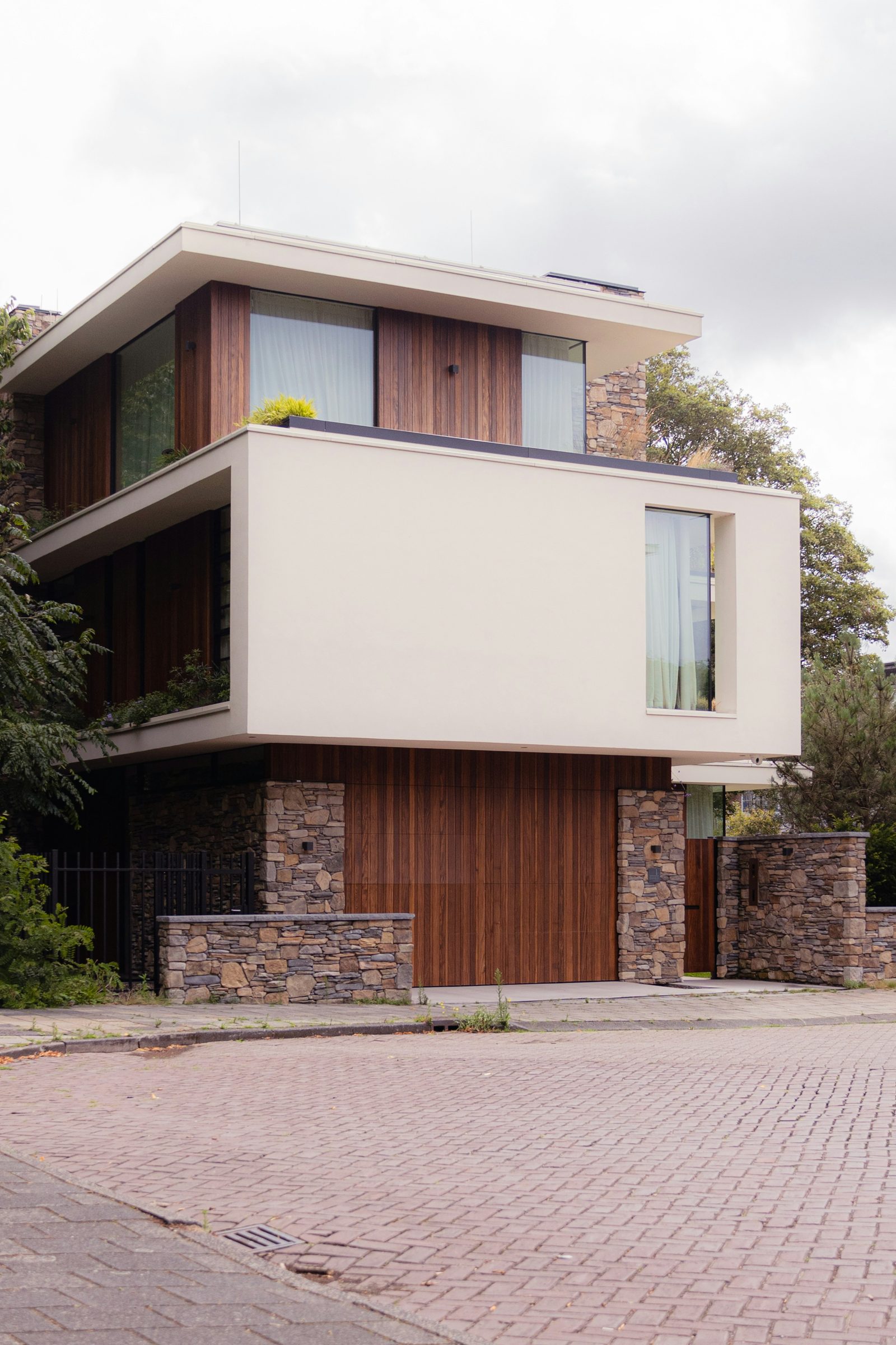 Modern home with large windows and timber cladding