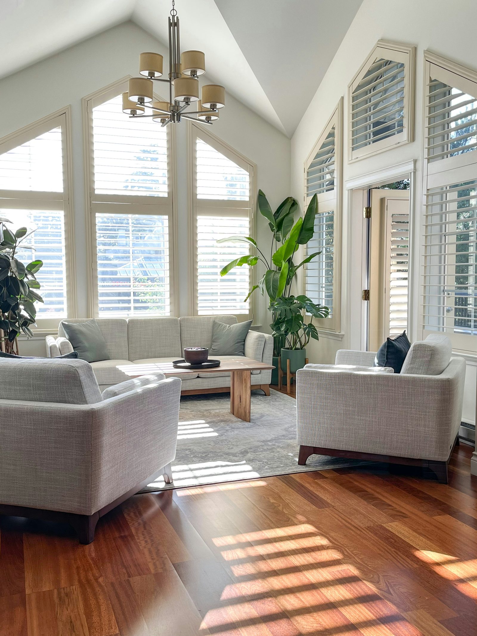 Bay window with plantation shutters in a bright sitting room