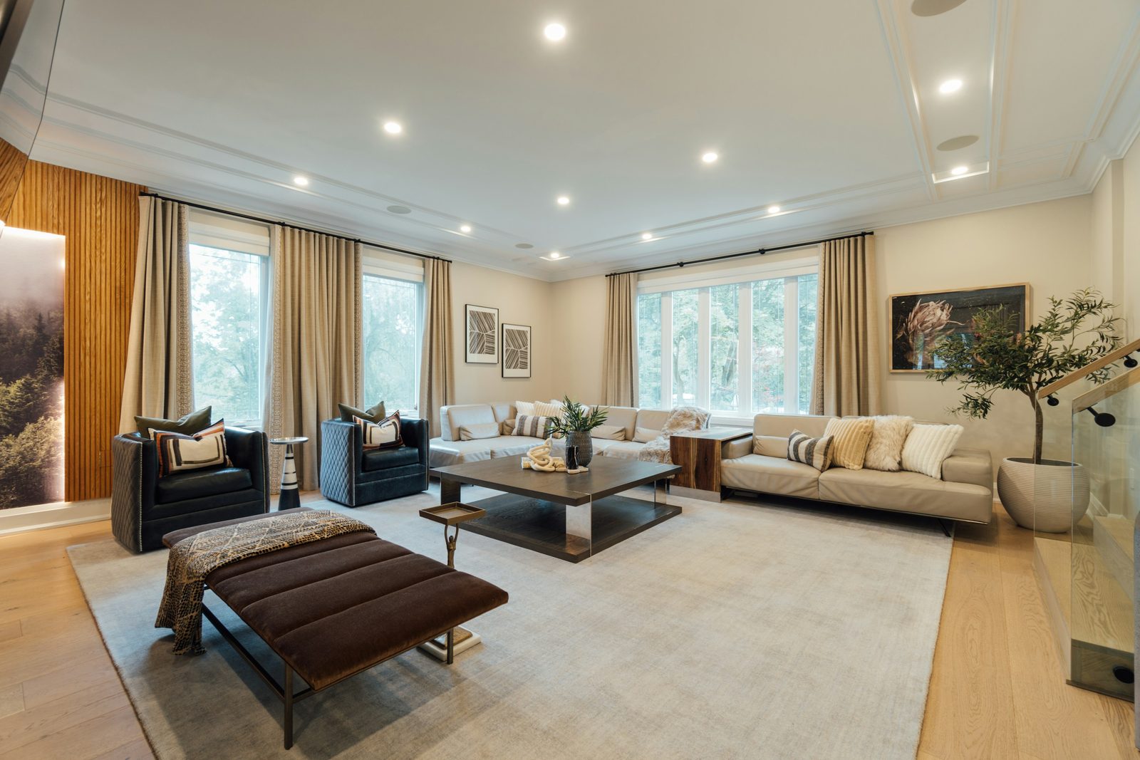Elegant lounge framed by tall curtained windows